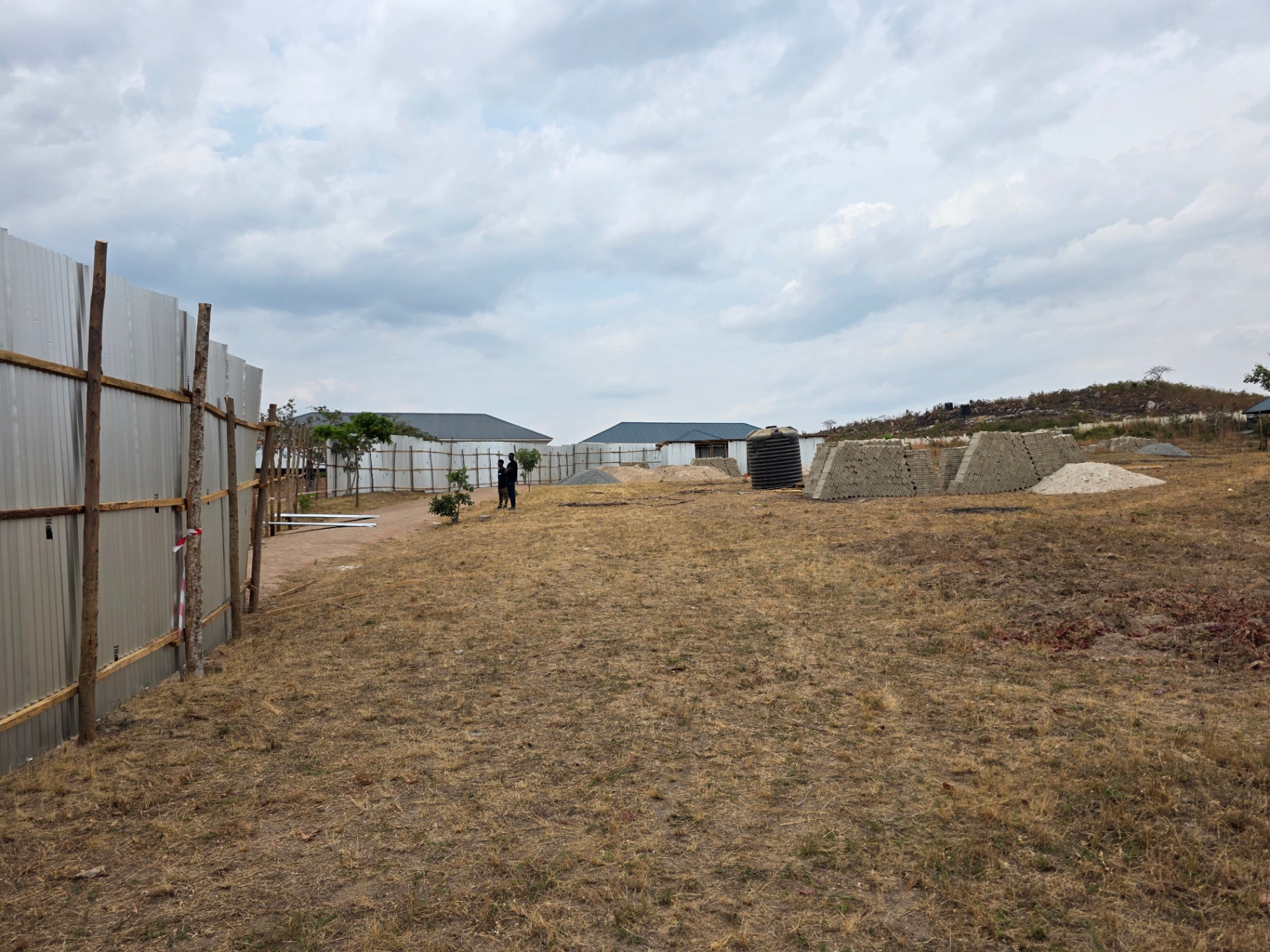 Wider view of the Katoro site with materials laid out for the works