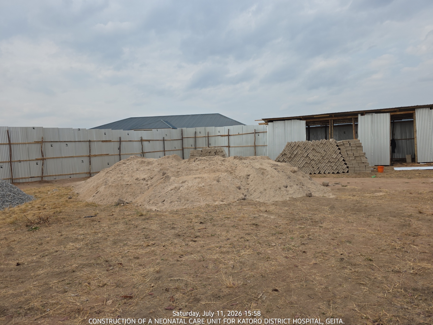 Sand stockpile and cement blocks staged on site